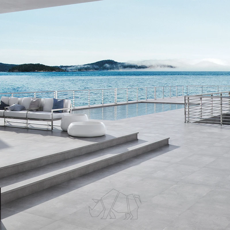 pavimento exterior gran formato en terraza con piscina